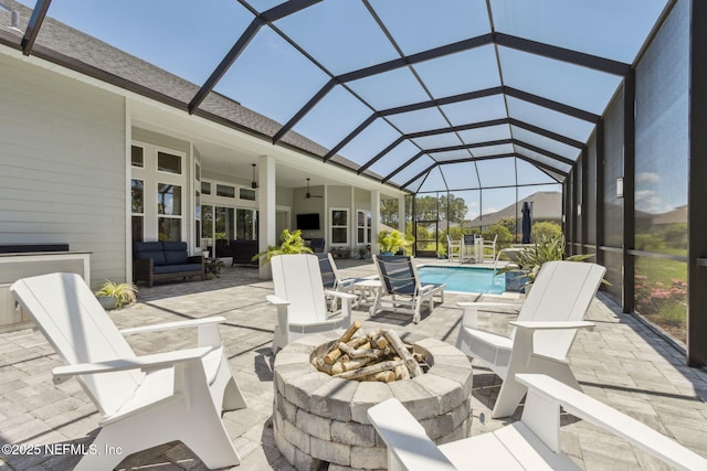 95049 Wild Cherry Dr, Fernandina Beach, FL 32034 - view of patio featuring an outdoor pool, an outdoor living space with a fire pit, ceiling fan, and glass enclosure