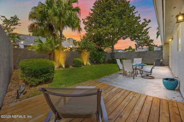 2715 Versailles Ct, Ponte Vedra Beach, FL 32082 - deck at dusk with outdoor dining area and a fenced backyard