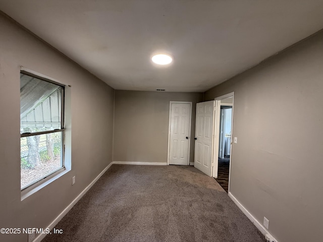 925 W 25th St, Jacksonville, FL 32209 - carpeted empty room with baseboards