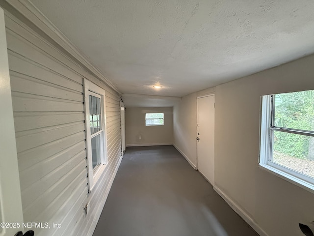 925 W 25th St, Jacksonville, FL 32209 - unfurnished room with a textured ceiling and concrete floors