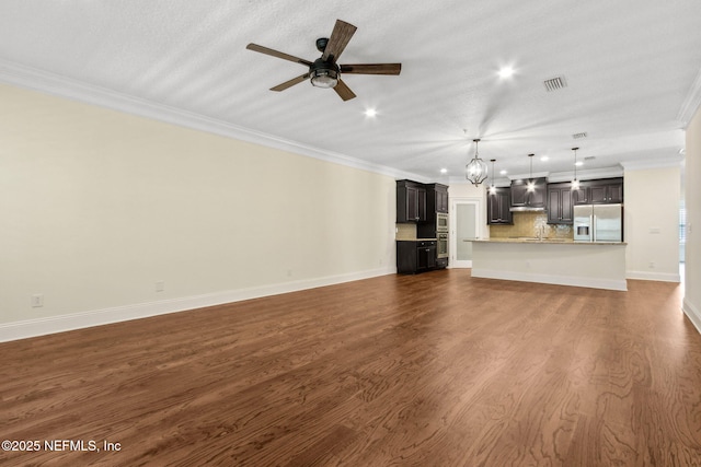 1387 Sunset View Ln, Jacksonville, FL 32207 - unfurnished living room featuring ornamental molding, a ceiling fan, recessed lighting, and dark wood finished floors