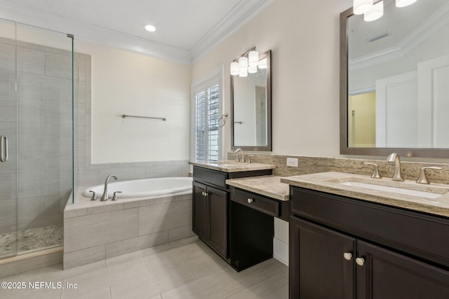 1387 Sunset View Ln, Jacksonville, FL 32207 - full bathroom with double vanity, a shower stall, a garden tub, tile patterned floors, and crown molding