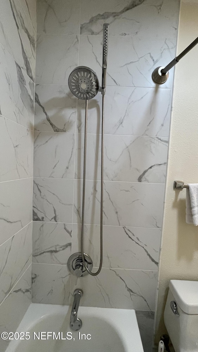 2708 SW 14th Dr Unit 220, Gainesville, FL 32608 - bathroom featuring shower / washtub combination and toilet