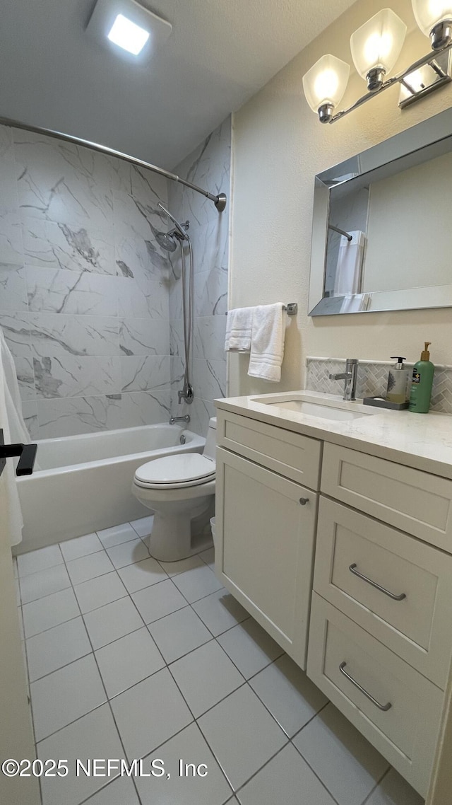 2708 SW 14th Dr Unit 220, Gainesville, FL 32608 - bathroom featuring shower / tub combo with curtain, vanity, and tile patterned floors