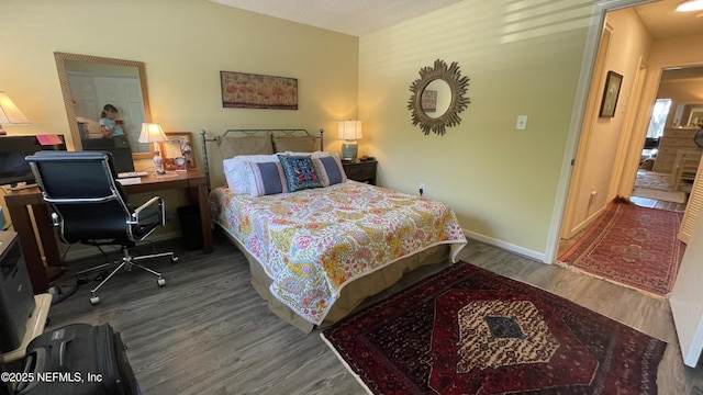2708 SW 14th Dr Unit 220, Gainesville, FL 32608 - bedroom featuring wood finished floors and an office area