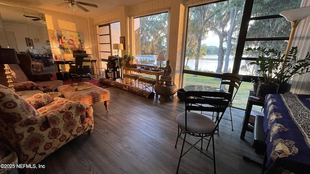 2708 SW 14th Dr Unit 220, Gainesville, FL 32608 - sunroom / solarium featuring a water view and wood finished floors