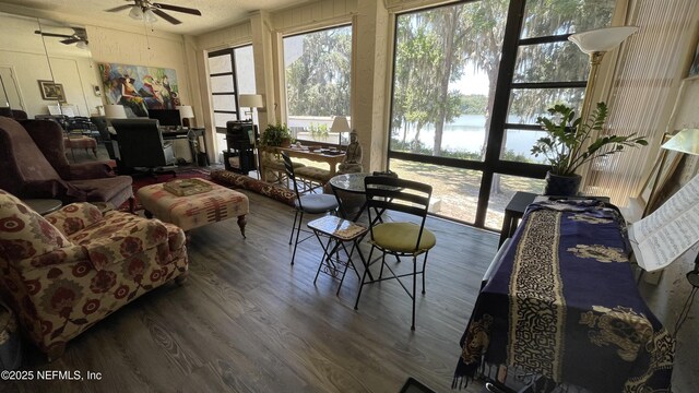 2708 SW 14th Dr Unit 220, Gainesville, FL 32608 - living room with wood finished floors and ceiling fan