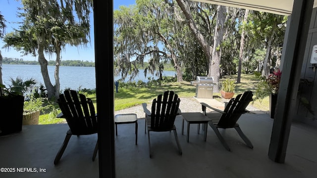 2708 SW 14th Dr Unit 220, Gainesville, FL 32608 - view of patio / terrace with a water view