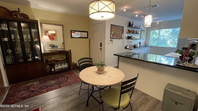 2708 SW 14th Dr Unit 220, Gainesville, FL 32608 - dining space featuring wood finished floors