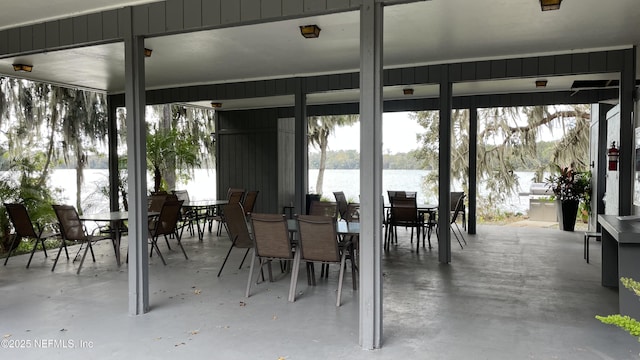 2708 SW 14th Dr Unit 220, Gainesville, FL 32608 - view of patio / terrace with outdoor dining area and a water view