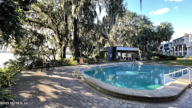 2708 SW 14th Dr Unit 220, Gainesville, FL 32608 - community pool featuring a patio area