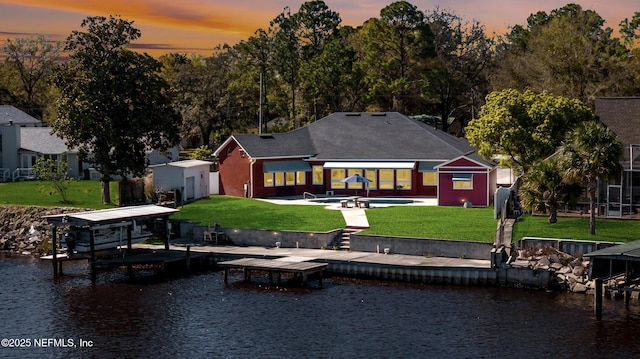 85712 Avant Rd, Yulee, FL 32097 - dock area with a water view, a yard, a patio area, and an outdoor pool