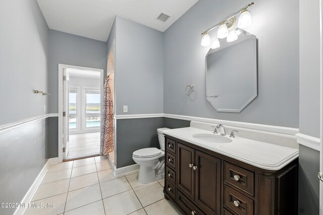 85712 Avant Rd, Yulee, FL 32097 - full bathroom with vanity, tile patterned floors, and curtained shower
