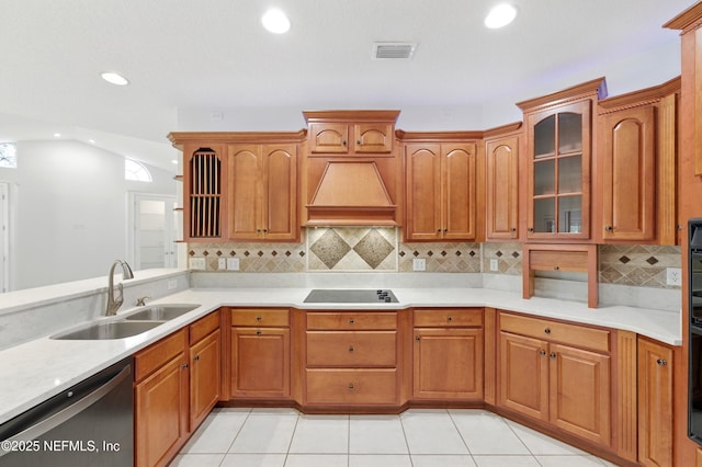 85712 Avant Rd, Yulee, FL 32097 - kitchen featuring dishwasher, custom exhaust hood, recessed lighting, light countertops, and glass insert cabinets