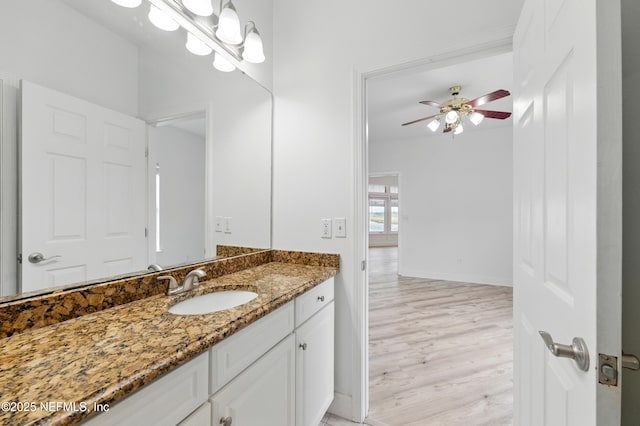 85712 Avant Rd, Yulee, FL 32097 - bathroom with vanity, wood finished floors, and a ceiling fan