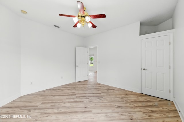 85712 Avant Rd, Yulee, FL 32097 - empty room with a ceiling fan, light wood-style floors, and a smoke detector