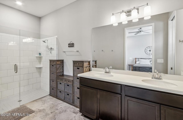 240 Julep St, Yulee, FL 32097 - ensuite bathroom with a ceiling fan, double vanity, a stall shower, and marble finish flooring