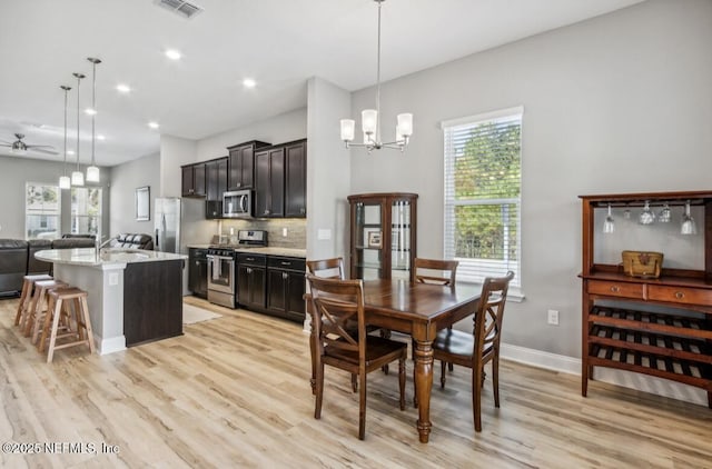 240 Julep St, Yulee, FL 32097 - dining area featuring light wood finished floors, plenty of natural light, a chandelier, a ceiling fan, and recessed lighting
