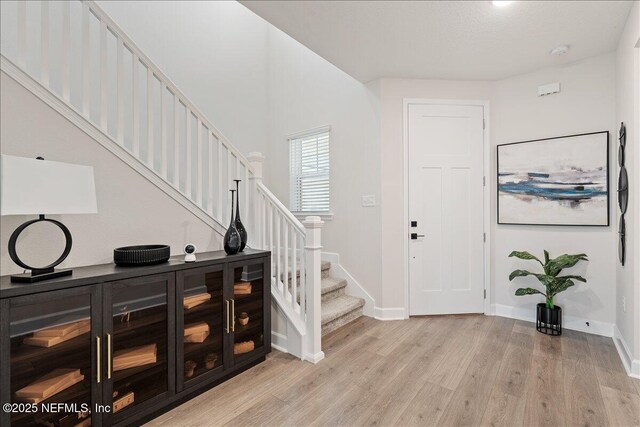 280 Cedar Elm Way, Saint Augustine, FL 32092 - foyer entrance with light wood-style floors and stairs