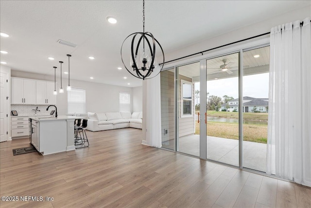 280 Cedar Elm Way, Saint Augustine, FL 32092 - unfurnished dining area with healthy amount of natural light, light wood finished floors, recessed lighting, and a chandelier