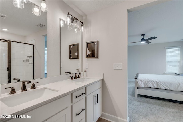280 Cedar Elm Way, Saint Augustine, FL 32092 - ensuite bathroom with double vanity, a stall shower, a ceiling fan, and a textured ceiling