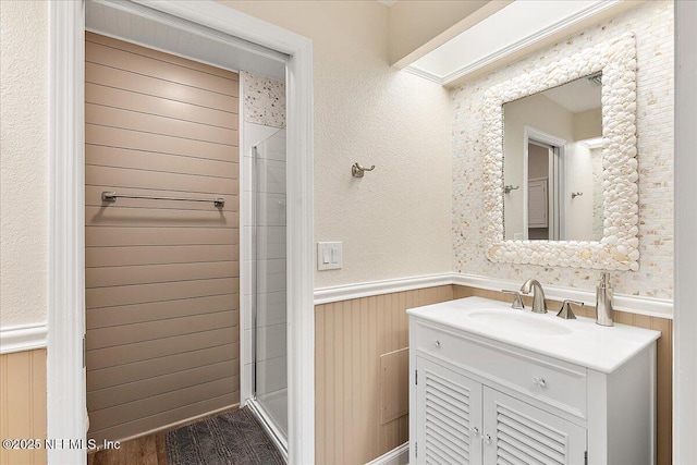 822 Coquina Bay, Ponte Vedra Beach, FL 32082 - full bathroom featuring a wainscoted wall, vanity, and a shower stall