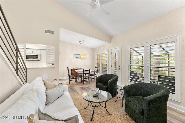 822 Coquina Bay, Ponte Vedra Beach, FL 32082 - living room featuring light wood-style flooring, ceiling fan, stairway, and high vaulted ceiling
