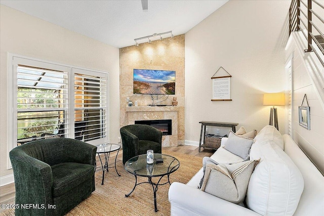 822 Coquina Bay, Ponte Vedra Beach, FL 32082 - living room featuring track lighting, wood finished floors, and a fireplace
