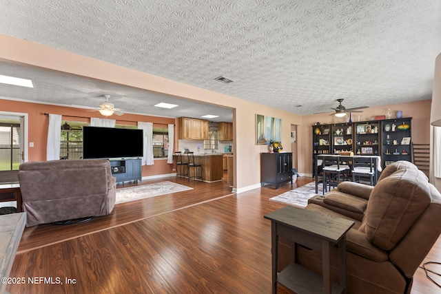 270 Drew St W, Baldwin, FL 32234 - living room featuring a ceiling fan, a textured ceiling, and wood finished floors