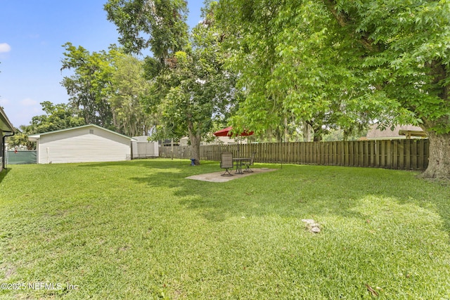 270 Drew St W, Baldwin, FL 32234 - fenced backyard featuring a patio area and an outbuilding