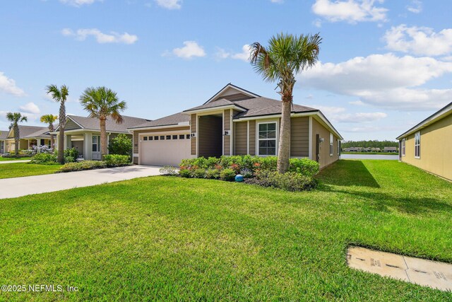 100 Dove Tree Ln, Saint Augustine, FL 32095 - single story home with an attached garage, concrete driveway, a front lawn, and roof with shingles