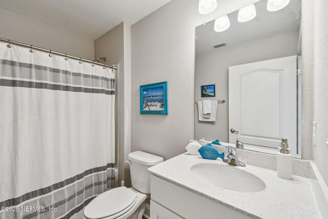 100 Dove Tree Ln, Saint Augustine, FL 32095 - bathroom with vanity, a textured ceiling, a textured wall, and curtained shower
