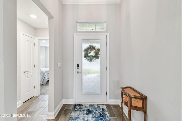 100 Dove Tree Ln, Saint Augustine, FL 32095 - foyer entrance featuring wood tiled floors and crown molding