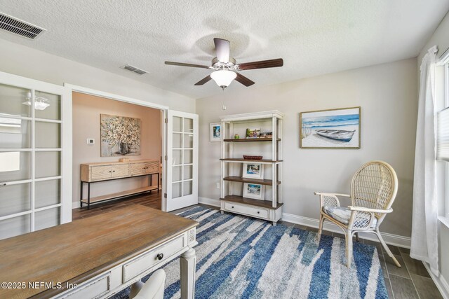 100 Dove Tree Ln, Saint Augustine, FL 32095 - office with ceiling fan, french doors, a textured ceiling, and wood finished floors