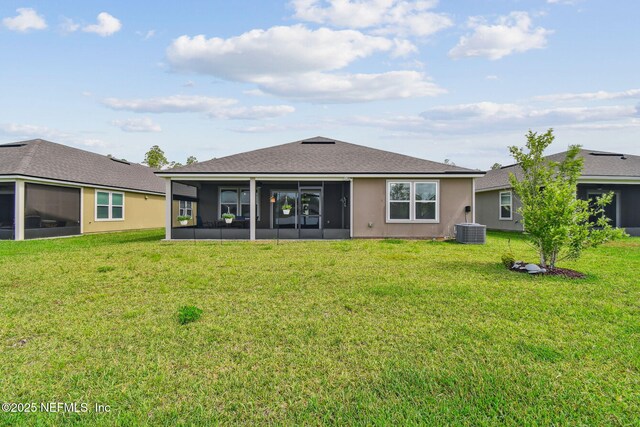 100 Dove Tree Ln, Saint Augustine, FL 32095 - back of property with a sunroom and a lawn