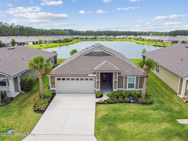 100 Dove Tree Ln, Saint Augustine, FL 32095 - ranch-style house featuring a residential view, an attached garage, a water view, and concrete driveway