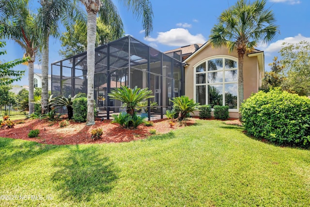 168 Pinehurst Pointe Dr, Saint Augustine, FL 32092 - rear view of house featuring a lawn, stucco siding, and a lanai