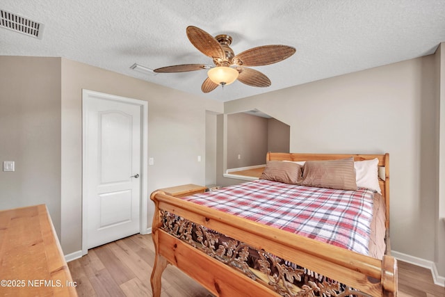 168 Pinehurst Pointe Dr, Saint Augustine, FL 32092 - bedroom with wood finished floors, a textured ceiling, and a ceiling fan