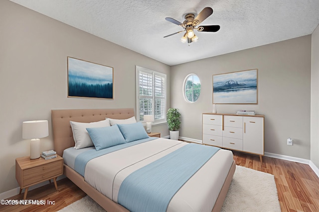 168 Pinehurst Pointe Dr, Saint Augustine, FL 32092 - bedroom with light wood-style floors, a textured ceiling, and a ceiling fan