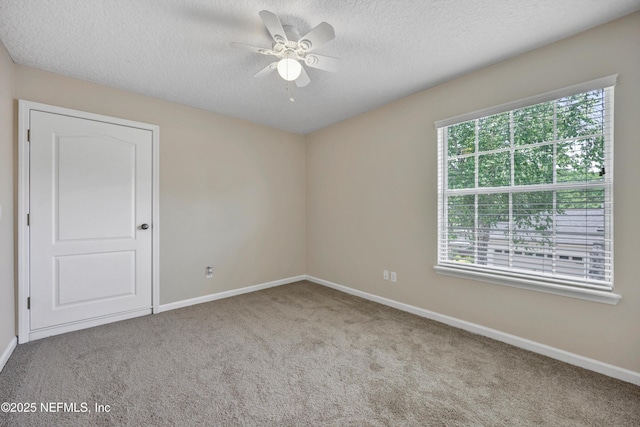 168 Pinehurst Pointe Dr, Saint Augustine, FL 32092 - carpeted empty room featuring a ceiling fan and a textured ceiling