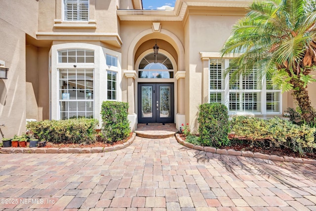 168 Pinehurst Pointe Dr, Saint Augustine, FL 32092 - entrance to property with french doors and stucco siding