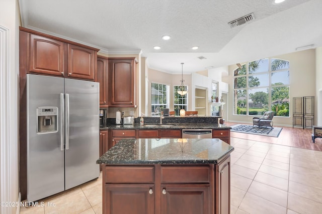 168 Pinehurst Pointe Dr, Saint Augustine, FL 32092 - kitchen with stainless steel appliances, recessed lighting, a textured ceiling, dark stone counters, and light tile patterned floors