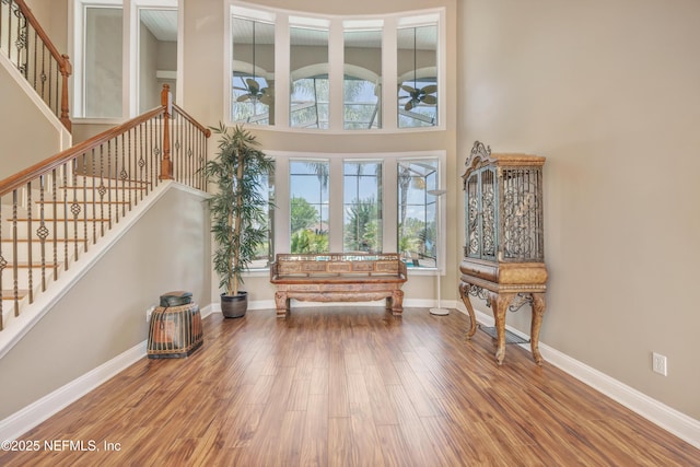 168 Pinehurst Pointe Dr, Saint Augustine, FL 32092 - entrance foyer featuring ceiling fan, wood finished floors, a towering ceiling, and stairway