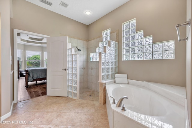 168 Pinehurst Pointe Dr, Saint Augustine, FL 32092 - ensuite bathroom featuring a bath, a walk in shower, and tile patterned flooring