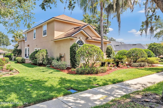 168 Pinehurst Pointe Dr, Saint Augustine, FL 32092 - view of side of home featuring stucco siding, a yard, and a shingled roof
