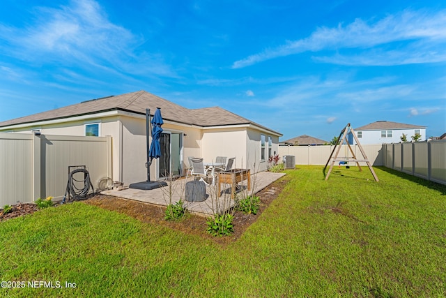 197 Jarama Cir, Saint Augustine, FL 32084 - back of house featuring a patio area, a playground, and a fenced backyard