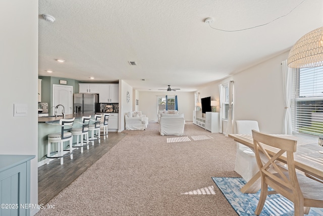 197 Jarama Cir, Saint Augustine, FL 32084 - living area with healthy amount of natural light, a ceiling fan, a textured ceiling, wood finished floors, and recessed lighting