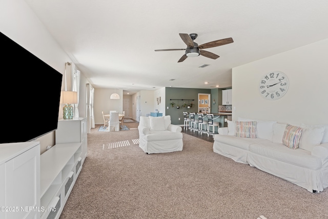 197 Jarama Cir, Saint Augustine, FL 32084 - living room with light carpet, a ceiling fan, and recessed lighting