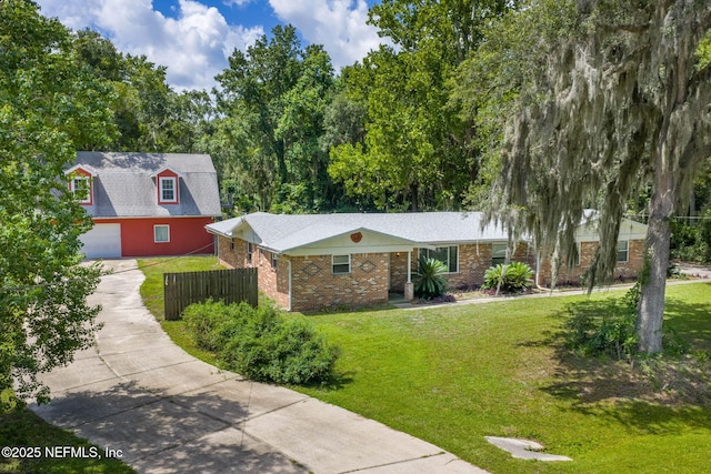 136 Hollywood Forest Dr, Fleming Island, FL 32003 - view of front of property with concrete driveway and brick siding