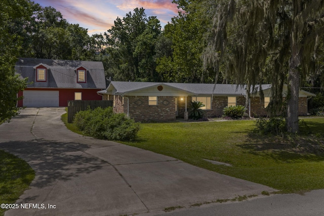 136 Hollywood Forest Dr, Fleming Island, FL 32003 - view of front of property with a garage, concrete driveway, and brick siding